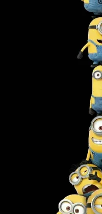 This lively phone live wallpaper features a cluster of cute minions stacked on top of one another against a black backdrop