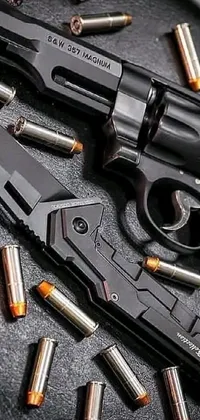 This phone live wallpaper features a close-up view of a gun resting on a table