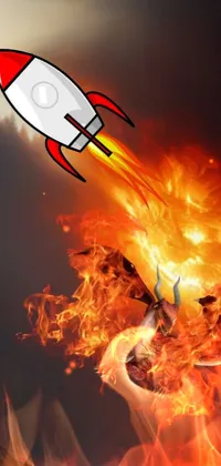 Looking for a captivating live wallpaper for your phone? Look no further than this thrilling design! It features a red and white rocket soaring through the air against a stunning campfire background
