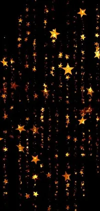This phone live wallpaper showcases a breathtaking display of digital art featuring shimmering gold stars against a black backdrop