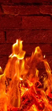 Set your phone ablaze with this stunning live wallpaper featuring a digitally rendered fire in front of a brick wall
