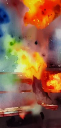 This phone live wallpaper features a man sitting on a bench in front of a fire, with a digital art watercolor splash background