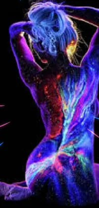 This phone live wallpaper features a mesmerizing and colorful woman sitting in a dark, psychedelic world