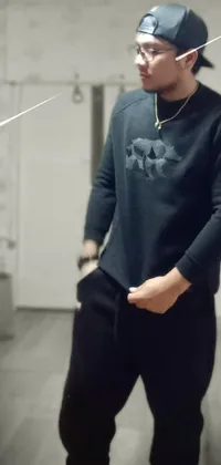 This phone live wallpaper depicts a man wearing a stylish sweatshirt in a room