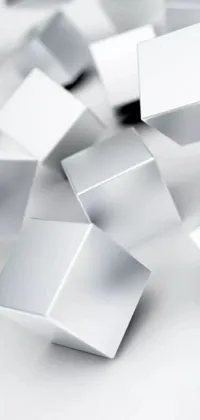 This phone live wallpaper showcases a visually stunning digital art featuring a pile of white cubes arranged in various shapes and sizes, creating intricate patterns