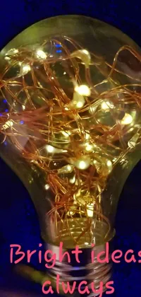 This mesmerizing phone live wallpaper features an art nouveau inspired light bulb with the words "bright ideas always sparkle"