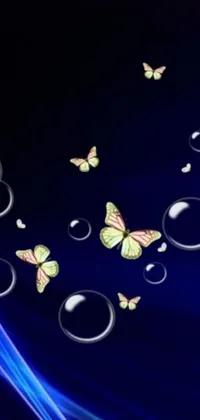 The Phone Live Wallpaper showcases a picturesque group of butterflies in flight, accompanied by floating bubbles, against a dreamy backdrop illuminated by black light
