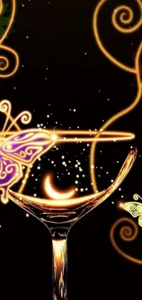 This phone live wallpaper features a stunning artistic creation featuring a close-up of a wine glass with a butterfly on it against a starry night sky