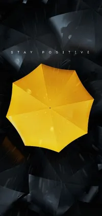 This stunning phone live wallpaper boasts a yellow umbrella that pops against a black background