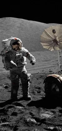 Experience the awe-inspiring sight of an astronaut on the moon in this stunning phone live wallpaper