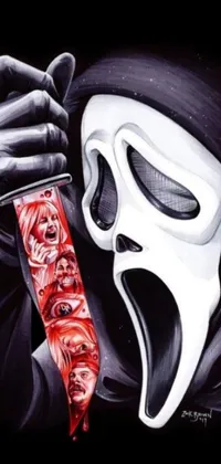 This live phone wallpaper features a scream face holding a shining knife