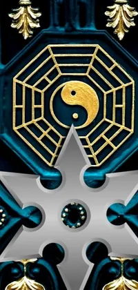 This live phone wallpaper features a close-up of a door adorned with a star design that includes yinyang-shaped patterns and complex decorative shapes