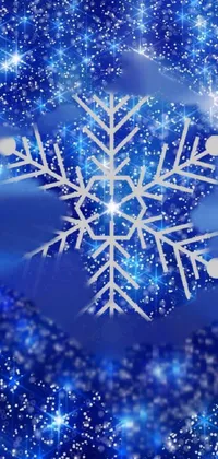 This live phone wallpaper features a beautiful snowflake on a snow-covered ground amidst a galaxy-themed background