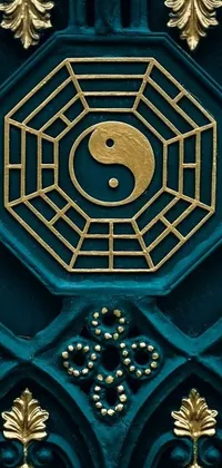 This captivating phone live wallpaper features a close-up of a mystical door with a yin symbol on it in a cloisonnism style and luxurious gold and teal color scheme