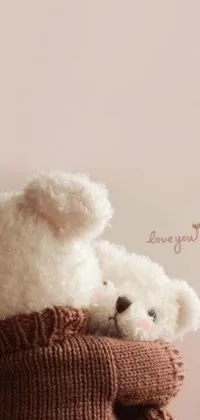 This phone live wallpaper features a lovely scene of two white teddy bears resting on a bed of pink and purple flowers