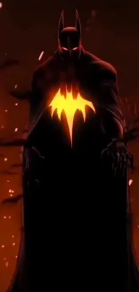 This phone live wallpaper features a breathtaking depiction of Batman standing in front of a blazing fire