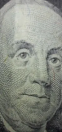This live wallpaper for your phone showcases a hyperrealistic close-up of a face on a dollar bill in stipple style