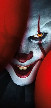 This live wallpaper features a terrifying Pennywise-style portrait in red and black