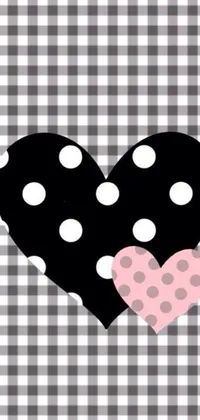 This lively phone live wallpaper flaunts a black and white checkerboard background embellished with a vibrant polka dot heart
