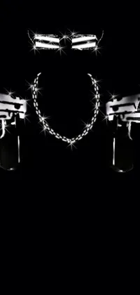 This live wallpaper features a striking black background adorned with two sleek guns, complimented by chains and rapper bling jewelry