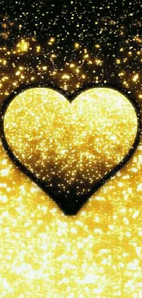 This phone live wallpaper features a beautiful heart shape with golden light illuminating from the center