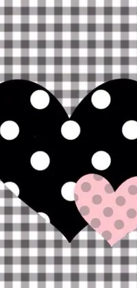 This phone live wallpaper showcases a playful and modern design featuring a polka dot heart against a black and white checkered background