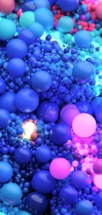 This live phone wallpaper features a close-up view of blue and pink digital balls made of nanomaterials