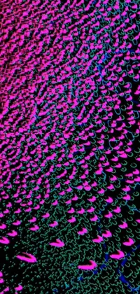 This phone live wallpaper features a dark background with pink and blue lights, a microscopic photo of microorganisms, generative art, and intricate textures