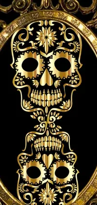 Get a stunning live wallpaper for your phone with a stylish gold skull framed on a black background