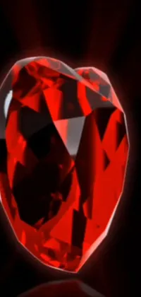 This live wallpaper features a digitally rendered red heart-shaped diamond on a sleek black background
