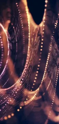 This live wallpaper features a shiny object, generative art, fairy lights, purple ribbons, and cyber decorations on a black background
