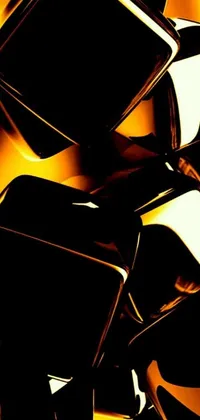 This stunning phone live wallpaper showcases a close up of shiny, gold and black objects that resemble molten glass