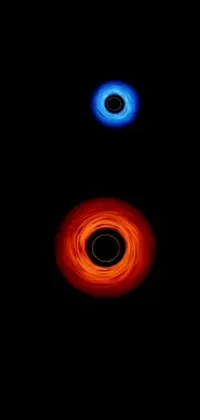 This live phone wallpaper features two black holes set against a dark background
