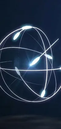This live wallpaper features a mesmerizing light orb amidst a hologram of orbital graphical lines and space satellites, immersing users with its intricate network and stunning visuals