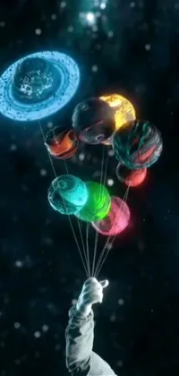 This stunning live wallpaper features a colorful scene of vibrant balloons swaying gently in the breeze, while a sleek and futuristic alien spaceship flies through deep space in the distance