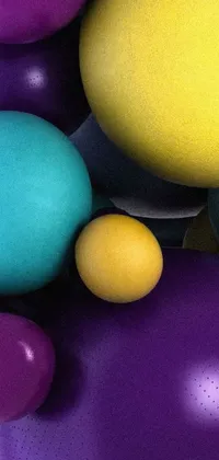 This live wallpaper for your phone is a burst of colors featuring purple, yellow and blue balloons