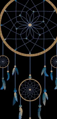 This stunning phone live wallpaper showcases a blue and gold dream catcher on a black background made of felt and cloth materials with intricate beadwork
