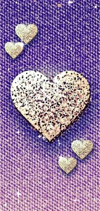 This live wallpaper displays a digital rendering of a heart on a purple background in a pointillism style