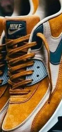This live phone wallpaper features a close-up of a pair of air force 1 sneakers laid on top of a detailed wooden table, designed by Niko Henrichon