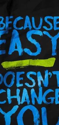 This live phone wallpaper showcases a black t-shirt with white writing that reads "because easy doesn't change you"