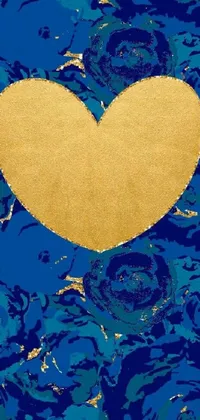 Elevate your phone's aesthetics with a stunning live wallpaper! This wallpaper features a gorgeous gold heart set against a beautiful blue background