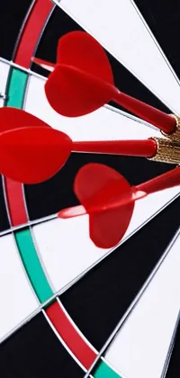 This dynamic phone wallpaper features three red darts in the center of a black and white dartboard, with a green bow and arrow detail at the bottom