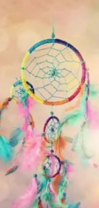 This live phone wallpaper is a colorful and vibrant dream catcher design that is sure to brighten up any mobile screen
