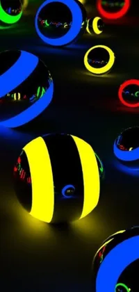 This live wallpaper features a group of glowing orbs set on a table, emanating vibrant neon colors of black, blue, and yellow
