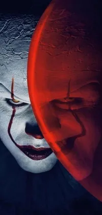 This live wallpaper features a menacing and evil clown with glowing eyes and vivid clown makeup