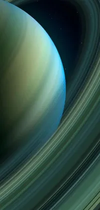 Get mesmerized by this live wallpaper featuring a stunning close-up of a planet surrounded by a ring, captured in a microscopic photo