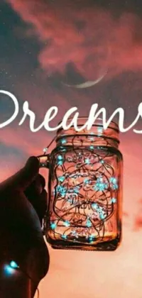 This phone live wallpaper features a stunningly dreamy scene with a jar filled with twinkling lights as the centerpiece