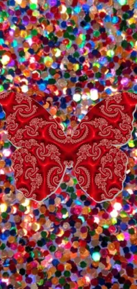 This live wallpaper features a red butterfly on a confetti pile, inspired by pointillism and paisley inlay