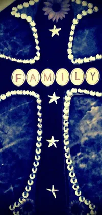 Get this stunning phone live wallpaper featuring a cross with the word family written in bold letters