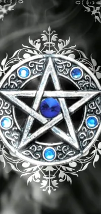 This phone live wallpaper boasts a mesmerizing silver pentagram lavished with blue crystals, exuding an alluring gothic antique outline